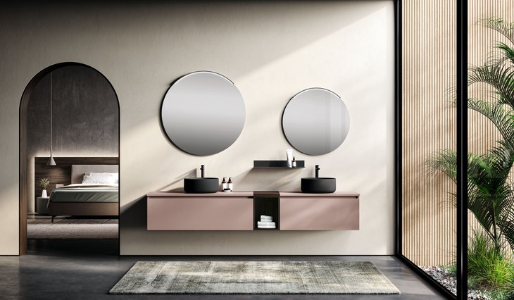 Bagno doppio lavabo rosa cipria con specchi tondi